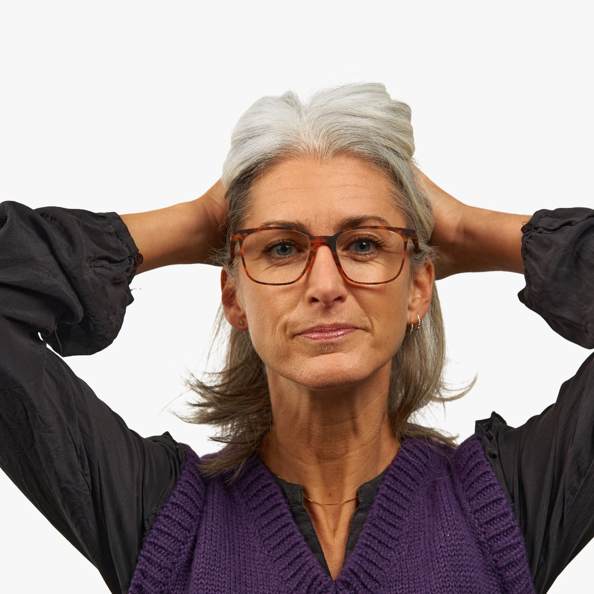Person wearing tortoiseshell rectangle eyeglasses