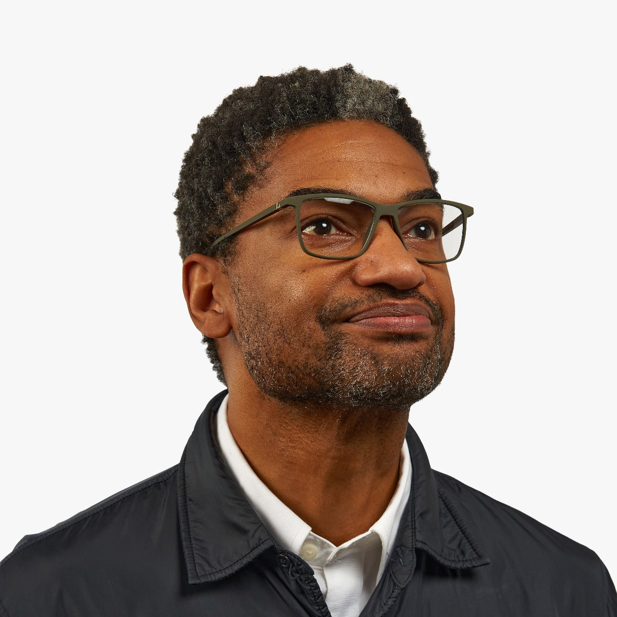 Person wearing København Dark Army eyeglasses in dark green rectangular frame