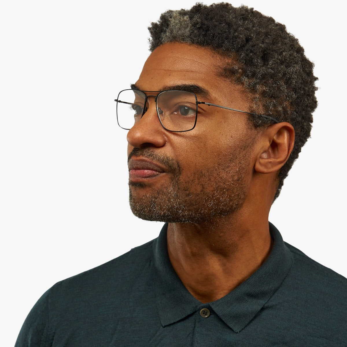 Person wearing Lidköping Black glasses with thin black frames