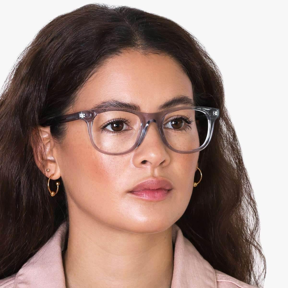 Person wearing Malmö Crystal Grey reading glasses